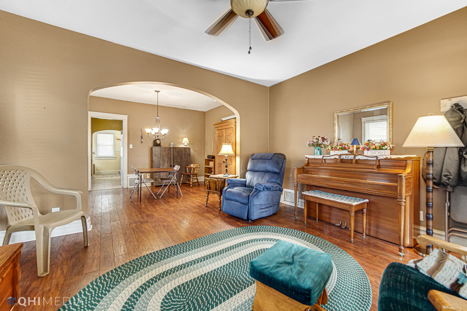 520 North Reed Street Joliet, IL 60435 - Photo 11 of 23 a living room with furniture and a chandelier