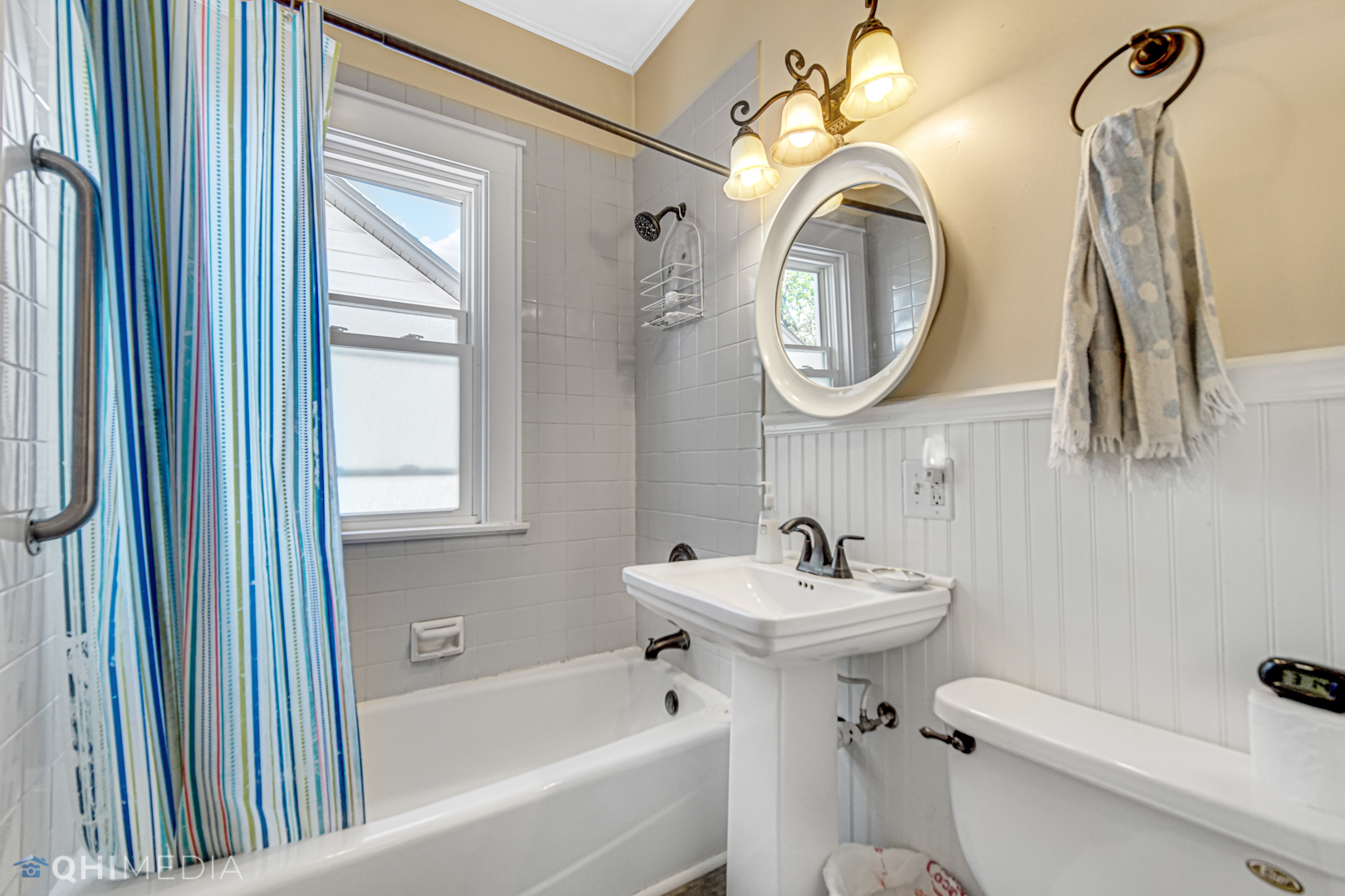 520 North Reed Street Joliet, IL 60435 - Photo 19 of 23 a bathroom with a toilet sink and mirror