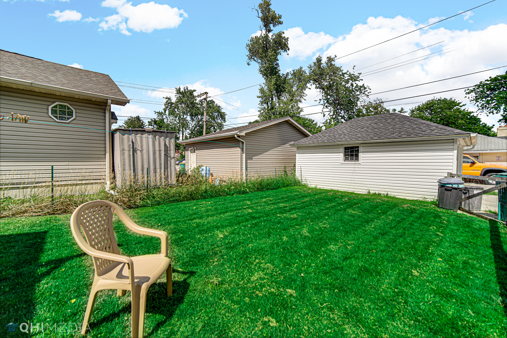 520 North Reed Street Joliet, IL 60435 - Photo 21 of 23 a backyard of a house with table and chairs
