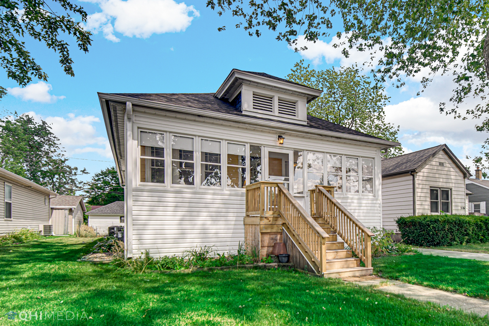 520 North Reed Street Joliet, IL 60435 - Photo 3 of 23 a front view of a house with a yard
