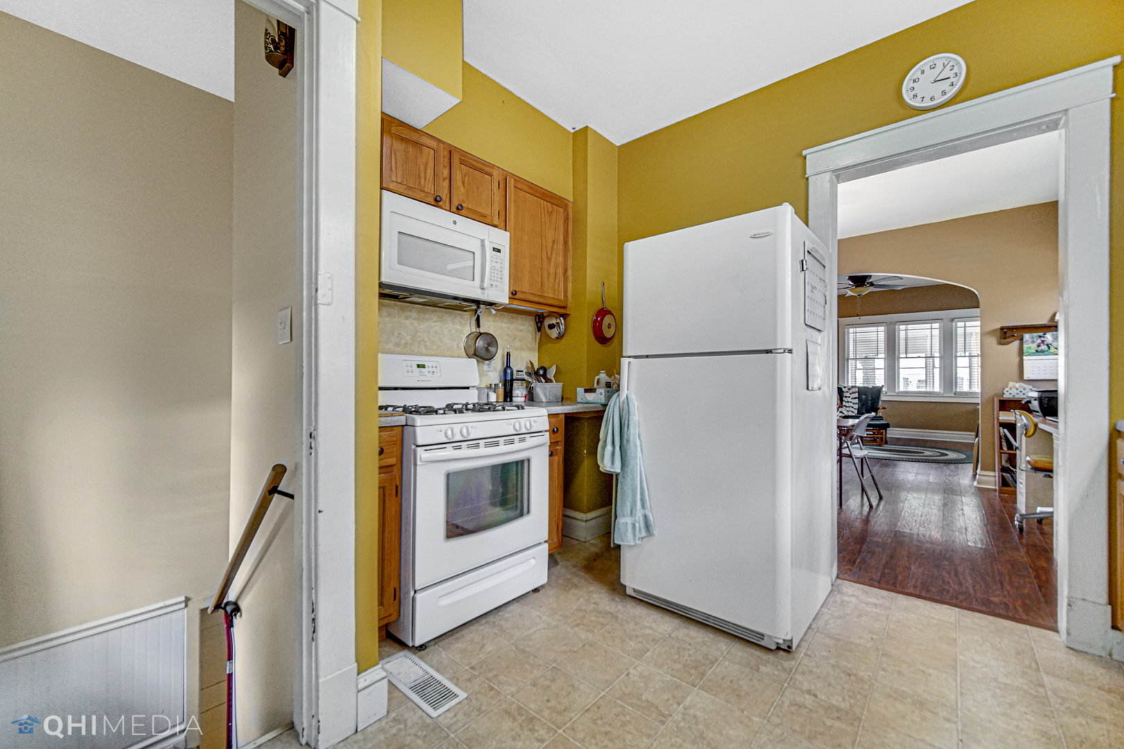 520 North Reed Street Joliet, IL 60435 - Photo 5 of 23 a white refrigerator freezer and a stove sitting inside of a kitchen