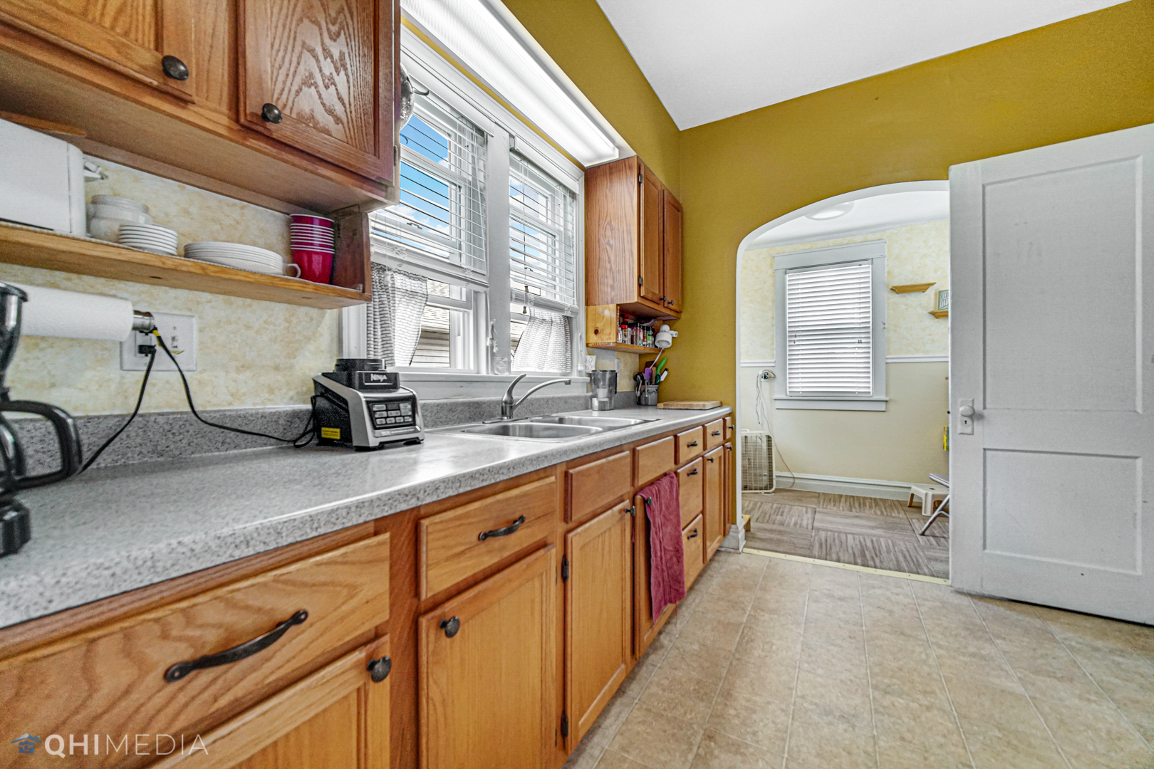 520 North Reed Street Joliet, IL 60435 - Photo 7 of 23 a kitchen with stainless steel appliances granite countertop a sink and a refrigerator