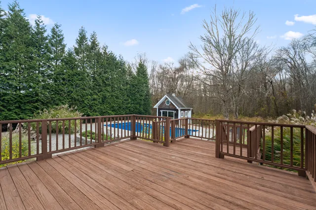 a view of house with backyard and outdoor seating