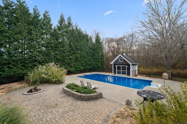 a house with trees in the background