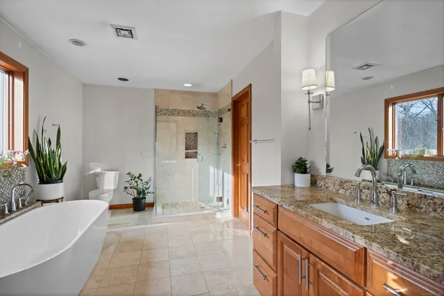 a white bath tub sitting in a bathroom