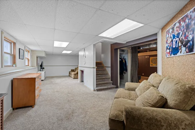 a kitchen with furniture and flat screen tv