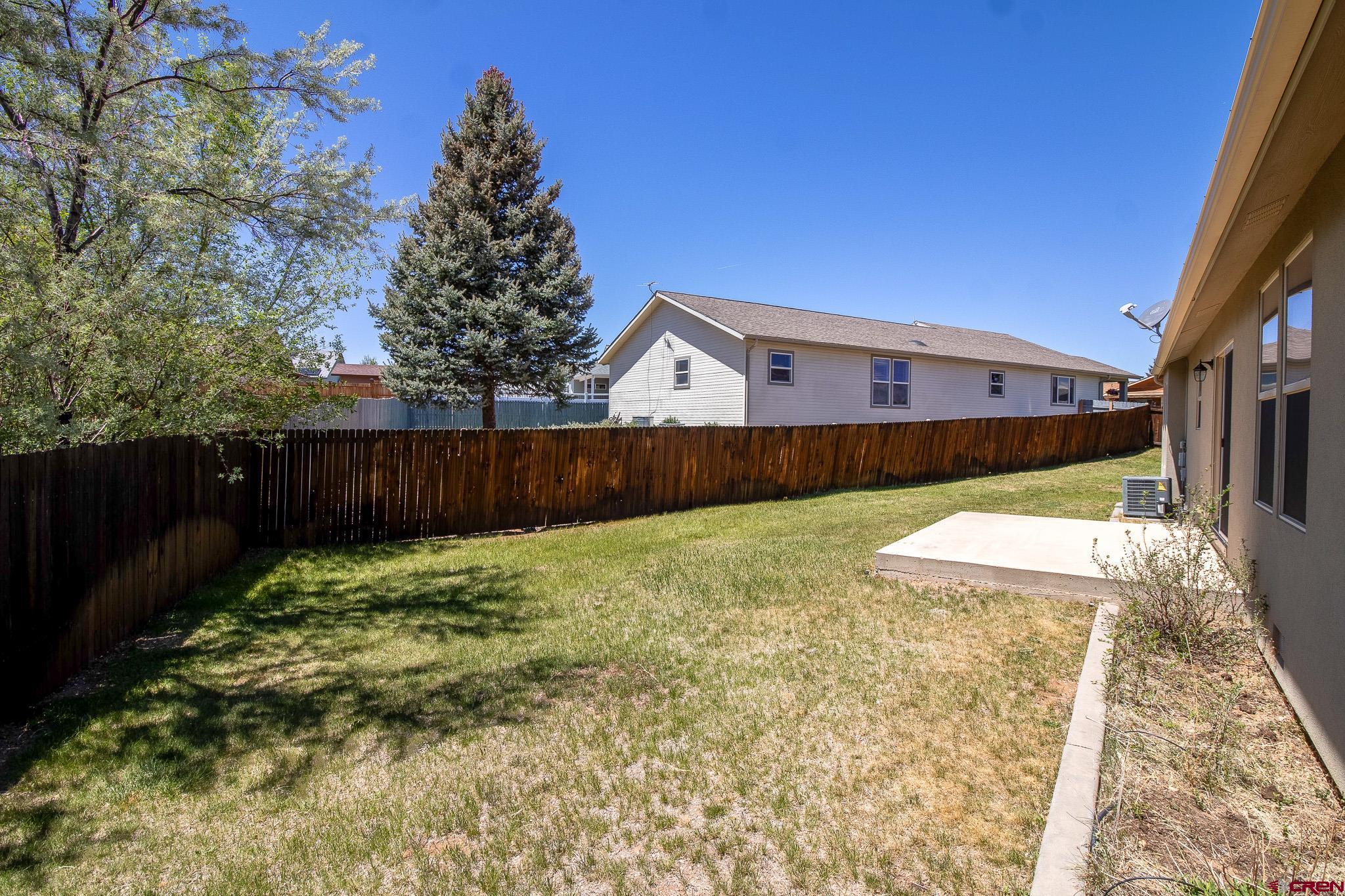 801 L Way Cortez, CO 81321 - Photo 22 of 41 a view of a backyard with wooden fence