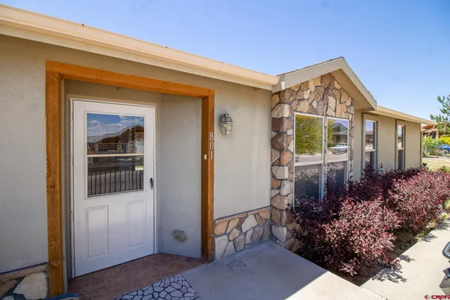 a view of a house with a small yard