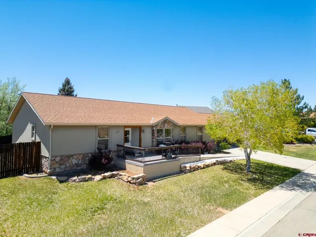 a view of a house with swimming pool and sitting area