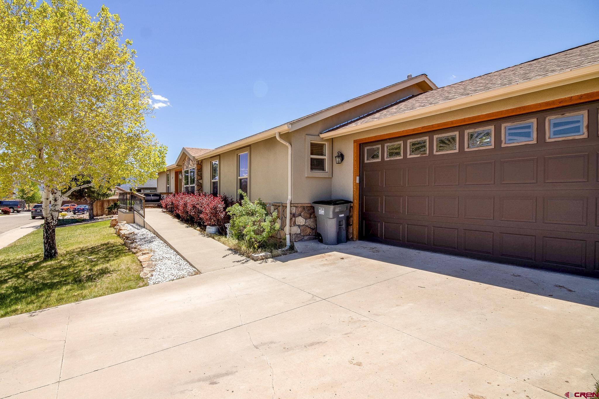801 L Way Cortez, CO 81321 - Photo 4 of 41 a backyard of a house with potted plants and seating space