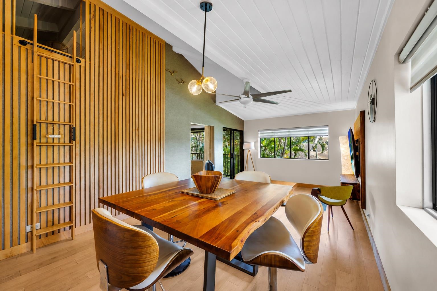 3788 Lower Honoapiilani Road, Unit E212 Lahaina, HI 96761 - Photo 13 of 35 a view of a dining room with furniture window and wooden floor