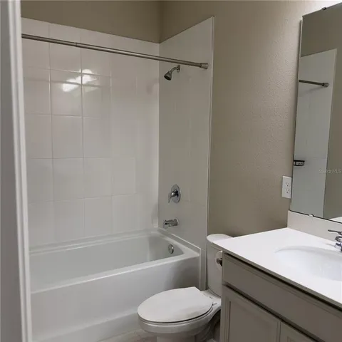 a room with a wooden shelf