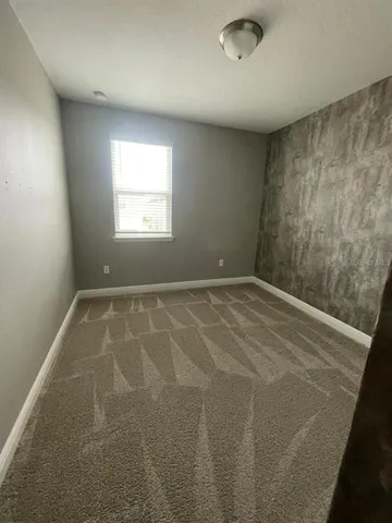 a bathroom with a double vanity sink toilet and a mirror