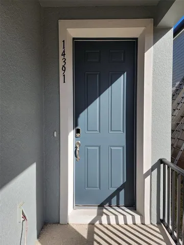 a view of bedroom with wooden floor