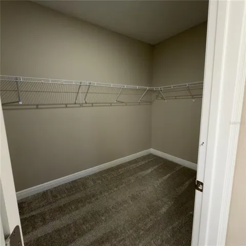 a utility room with sink dryer and washer