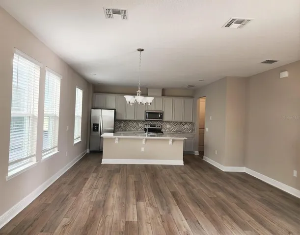 a large kitchen with a lot of counter space