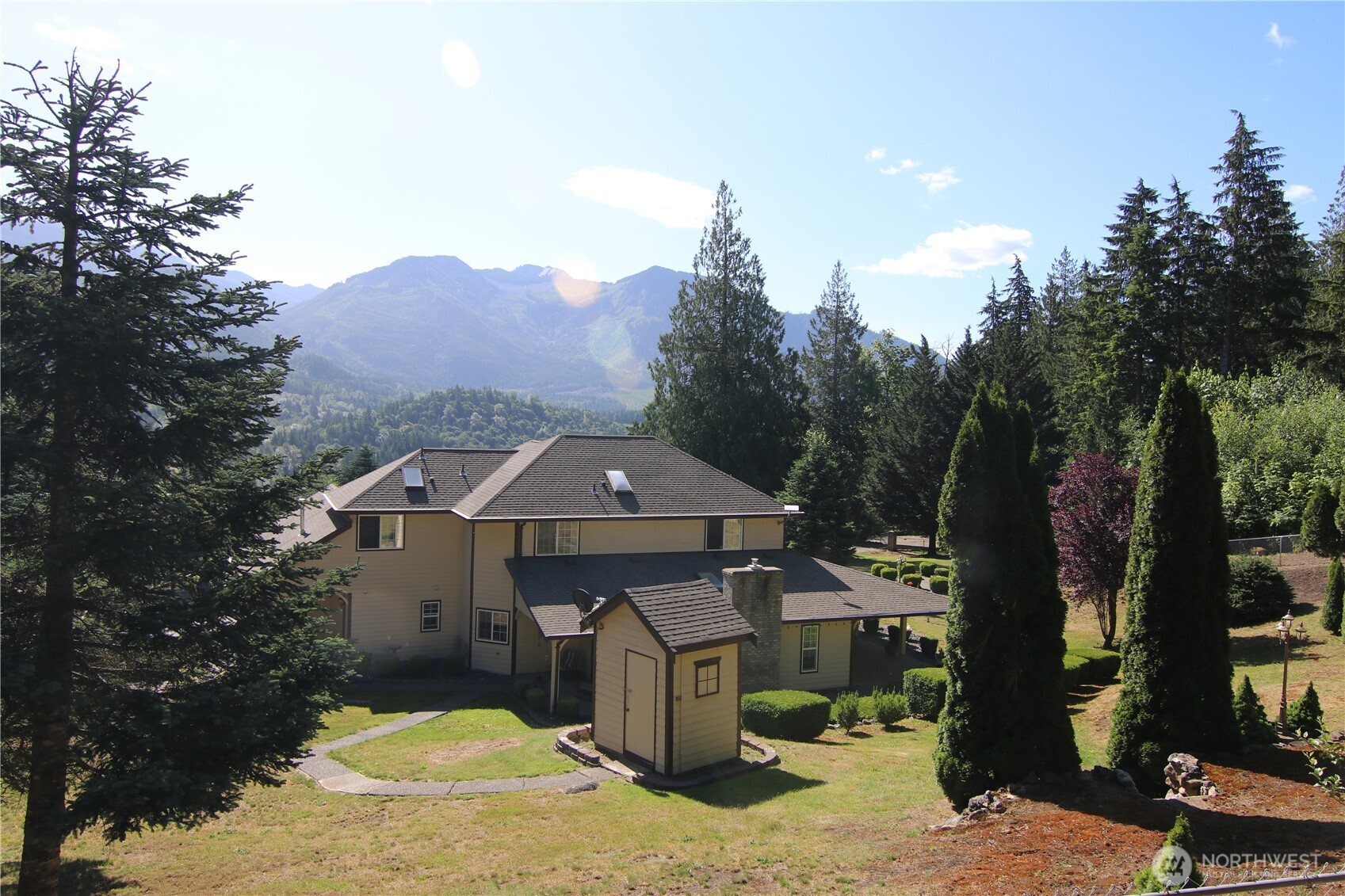 5860 Bell Creek Road Deming, WA 98244 - Photo 1 of 39 a front view of a house with a yard