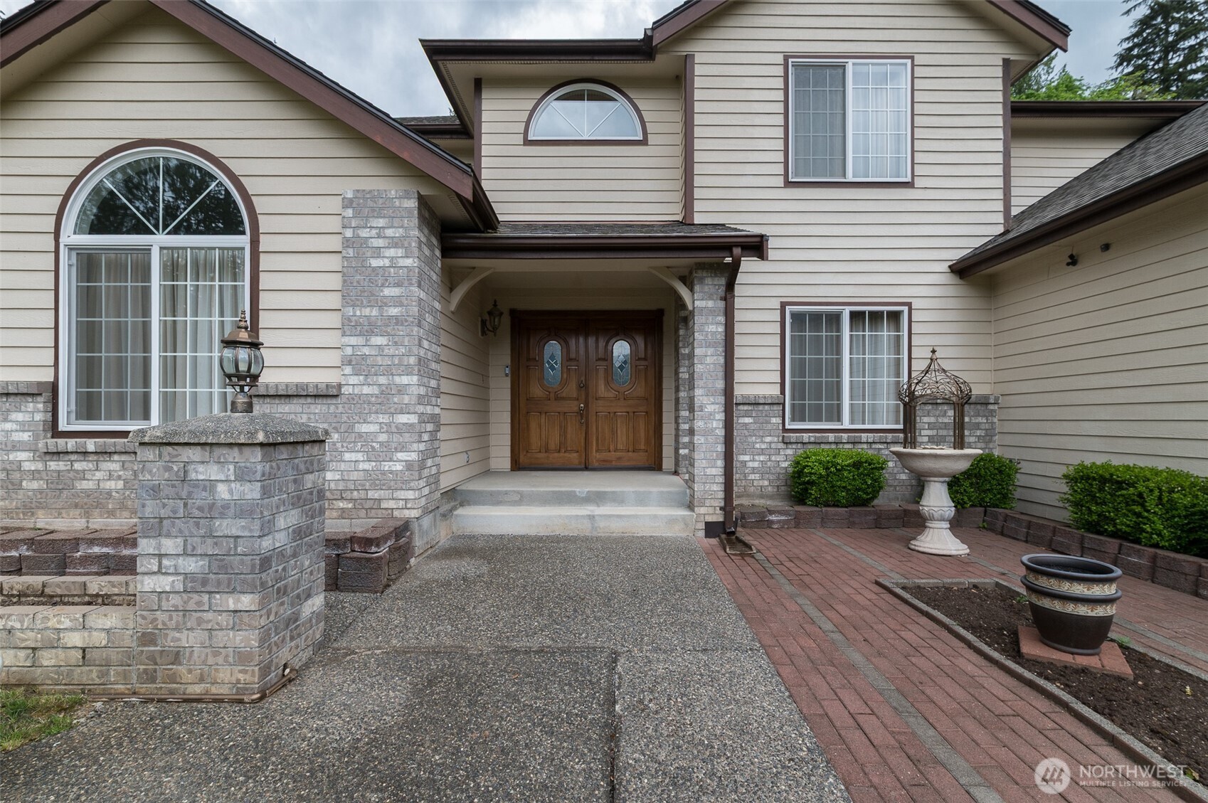 5860 Bell Creek Road Deming, WA 98244 - Photo 17 of 39 a view of a brick house with potted plants