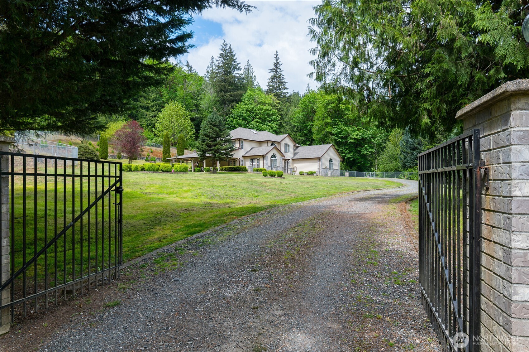 5860 Bell Creek Road Deming, WA 98244 - Photo 2 of 39 a view of a backyard with wooden fence