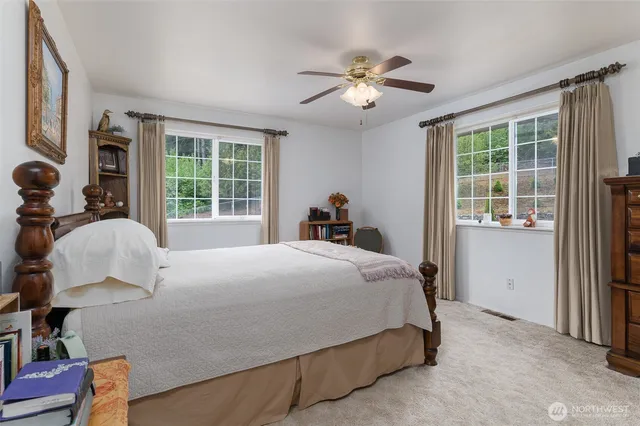 a bedroom with a bed and window