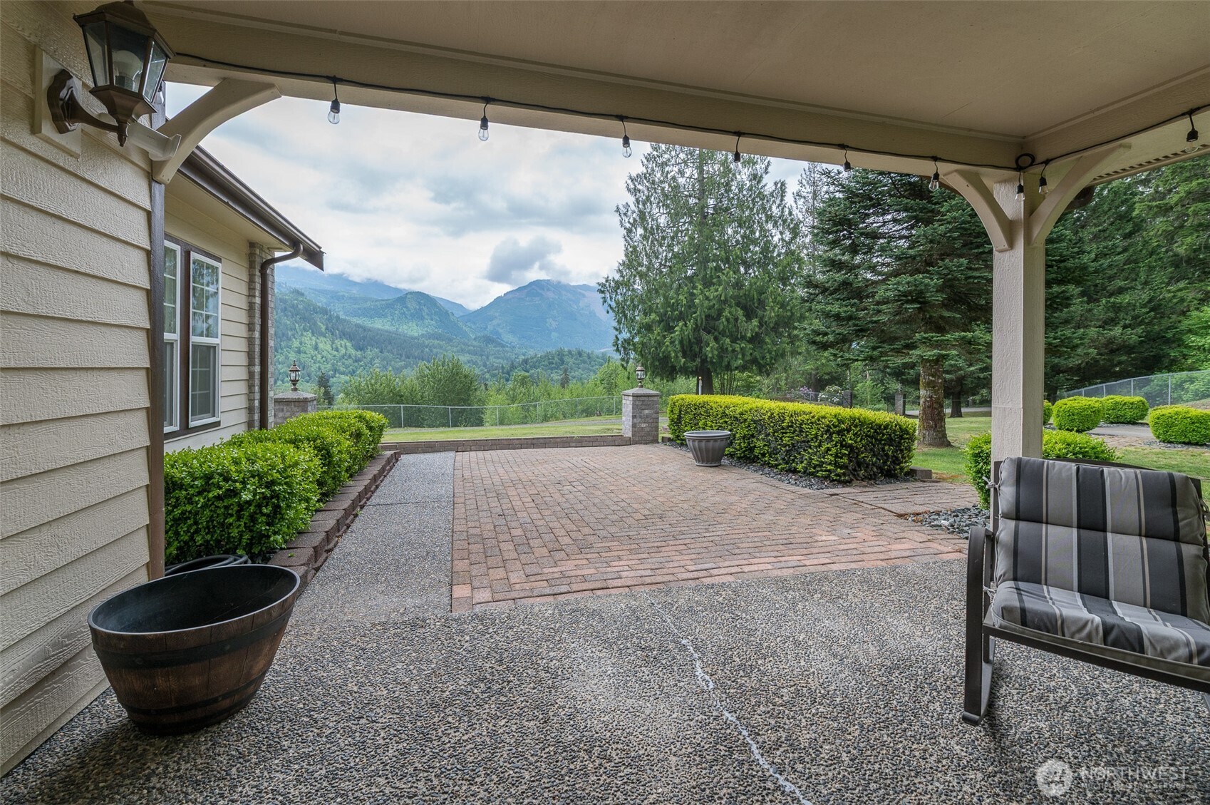 5860 Bell Creek Road Deming, WA 98244 - Photo 26 of 39 a view of a backyard with plants and a patio