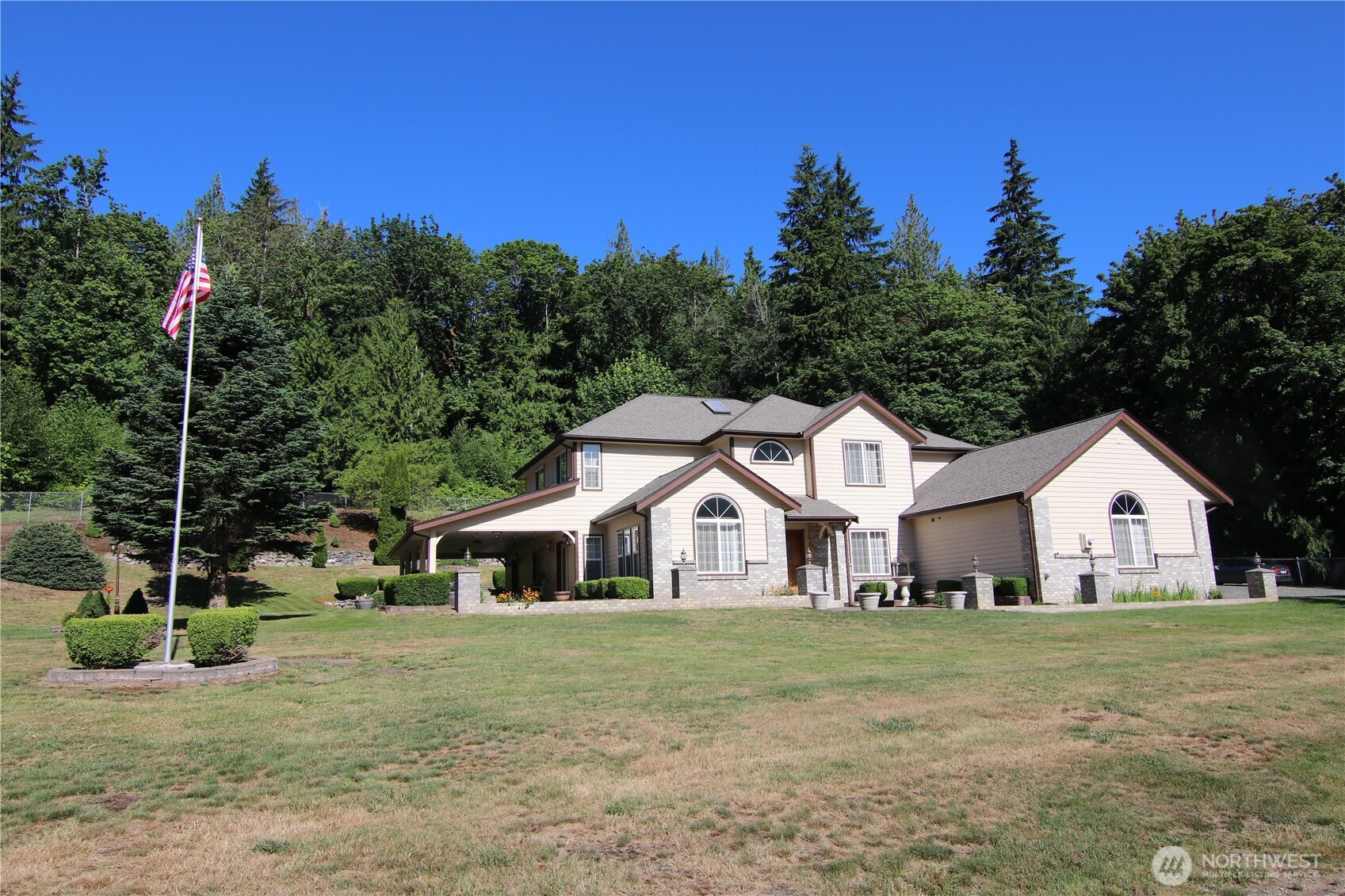 5860 Bell Creek Road Deming, WA 98244 - Photo 36 of 39 a front view of a house with garden