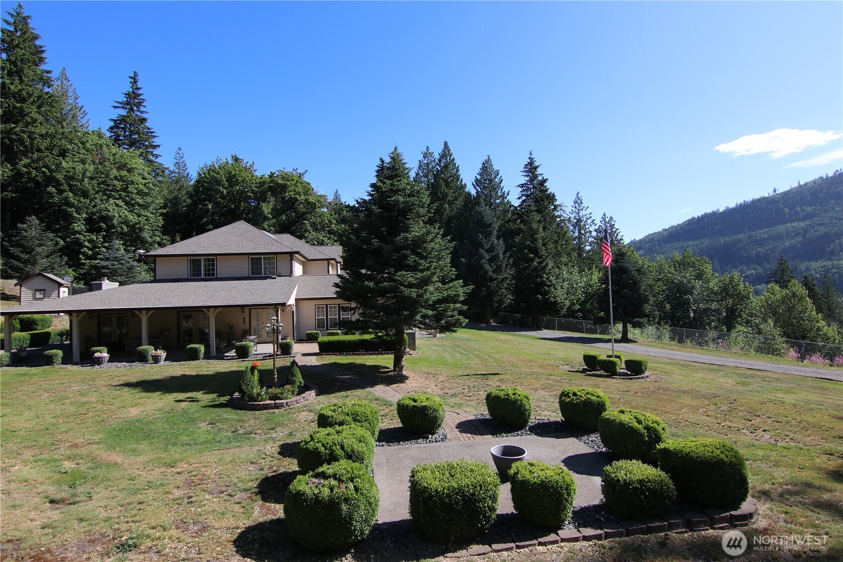 5860 Bell Creek Road Deming, WA 98244 - Photo 5 of 39 a view of a patio with swimming pool table and chairs