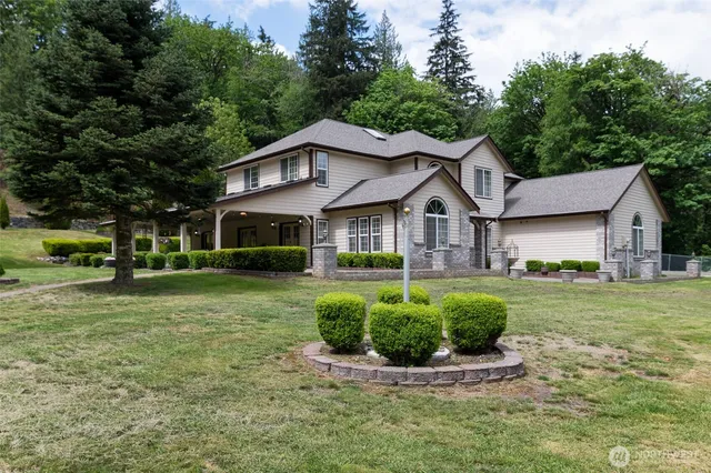 a front view of a house with a yard