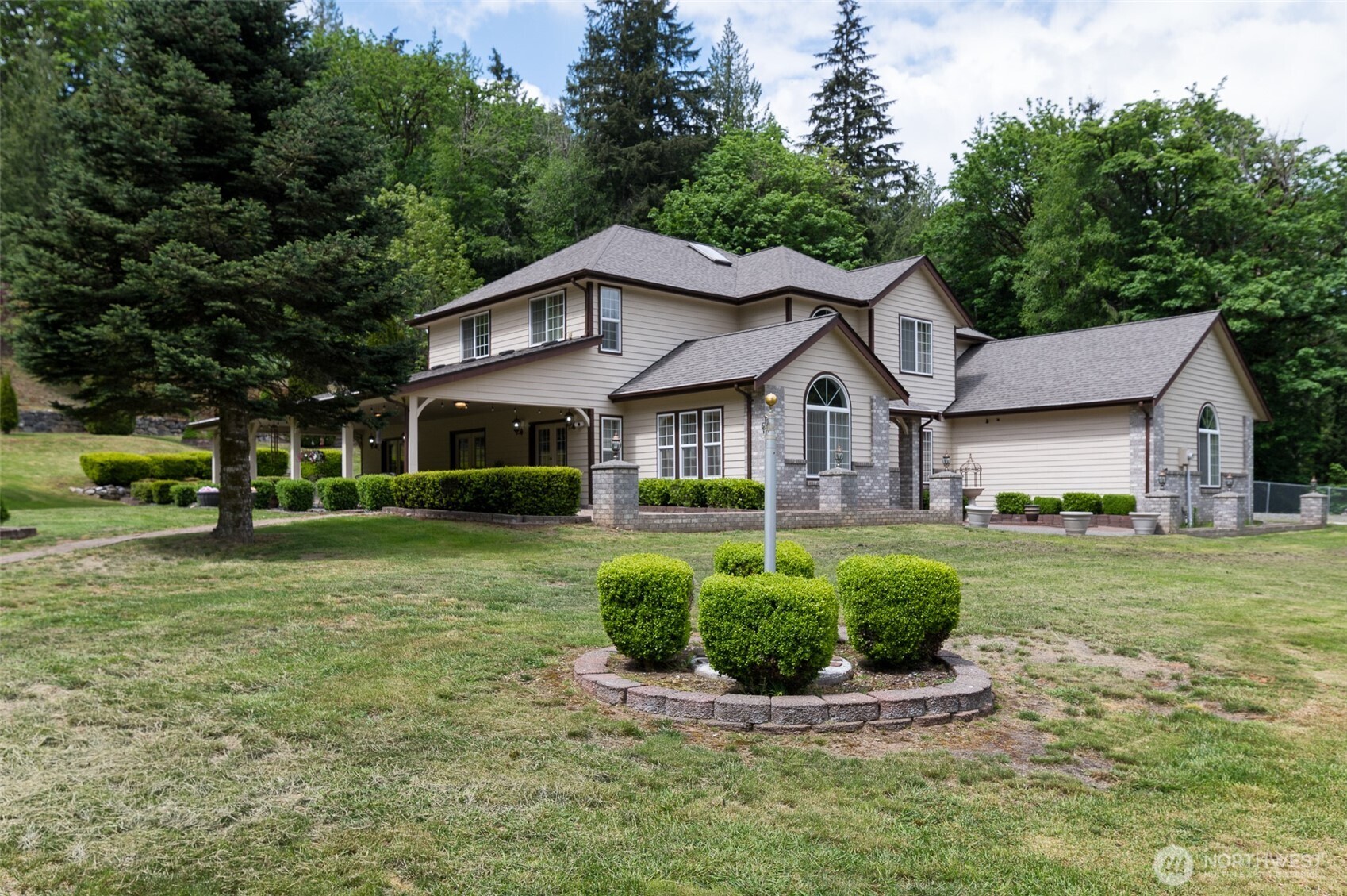 5860 Bell Creek Road Deming, WA 98244 - Photo 6 of 39 a front view of a house with a yard