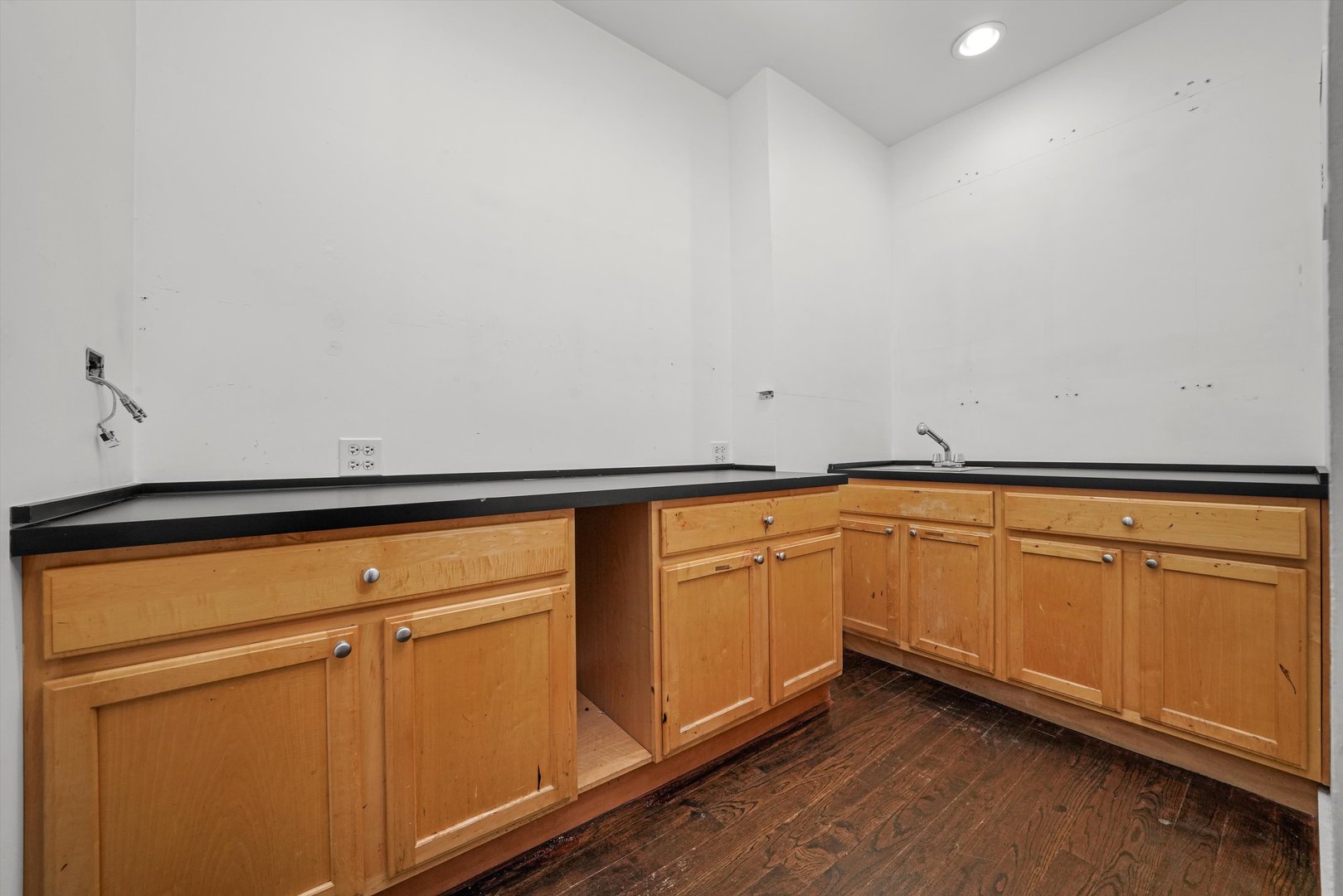 1412 West Division Street, Unit C1 Chicago, IL 60642 - Photo 26 of 28 a kitchen with granite countertop white cabinets and white appliances