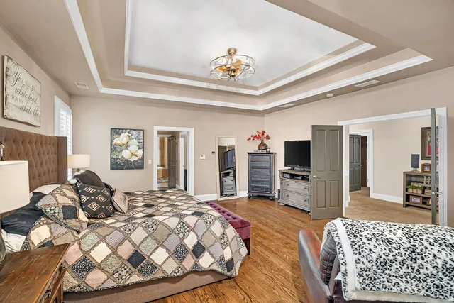 a large kitchen with a large counter top appliances and cabinets