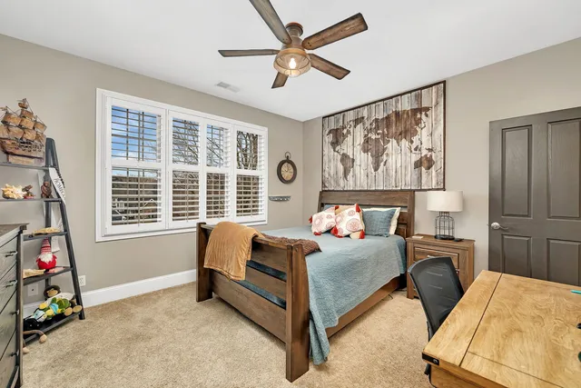 a bathroom with a sink mirror vanity and toilet
