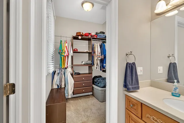 a bedroom with a large bed and a flat screen tv