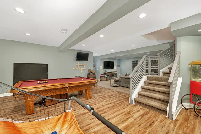 a bathroom with a granite countertop sink a toilet and shower