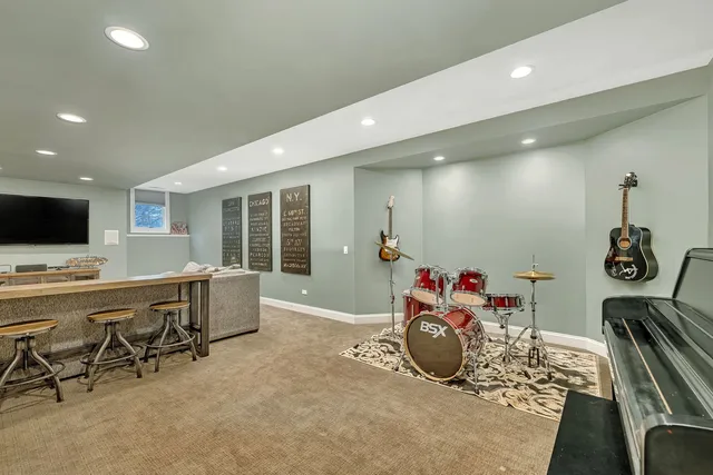 a view of a patio with table and chairs with wooden fence and floor