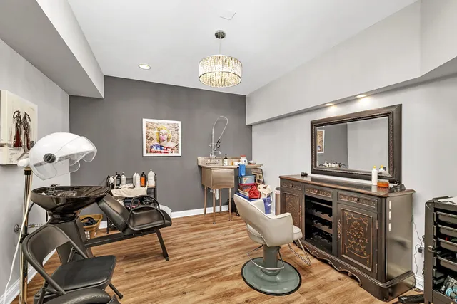 a view of a patio with table and chairs and potted plants