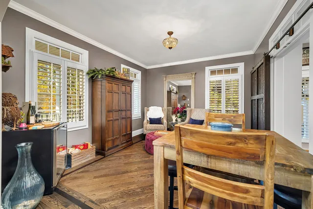 a kitchen with stainless steel appliances granite countertop a stove a sink dishwasher and cabinets with wooden floor