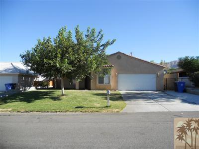 66120 Santa Rosa Road Desert Hot Springs, CA 92240 - Photo 1 of 9 a house that has a tree in front of it
