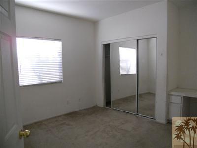 66120 Santa Rosa Road Desert Hot Springs, CA 92240 - Photo 6 of 9 an empty room with windows