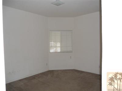 66120 Santa Rosa Road Desert Hot Springs, CA 92240 - Photo 7 of 9 an empty room with a window