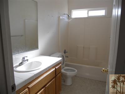 66120 Santa Rosa Road Desert Hot Springs, CA 92240 - Photo 9 of 9 a bathroom with a sink toilet and shower