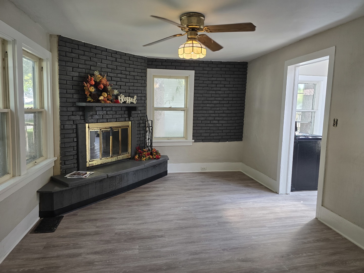 103 West Cherokee Avenue Shabbona, IL 60550 - Photo 24 of 42 a living room with furniture and a fireplace
