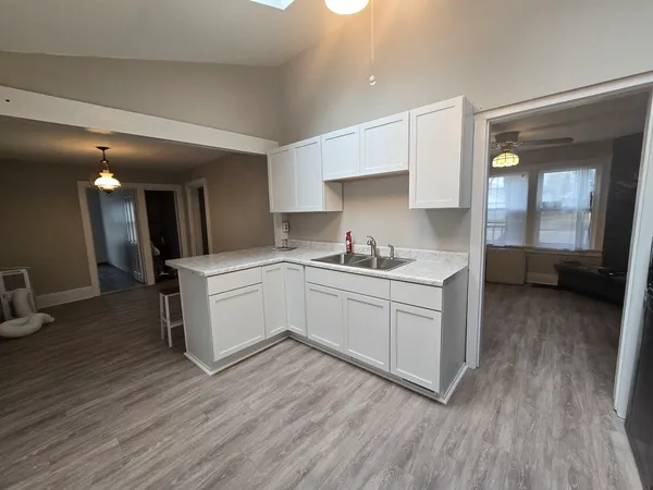 a kitchen with a stove and a refrigerator