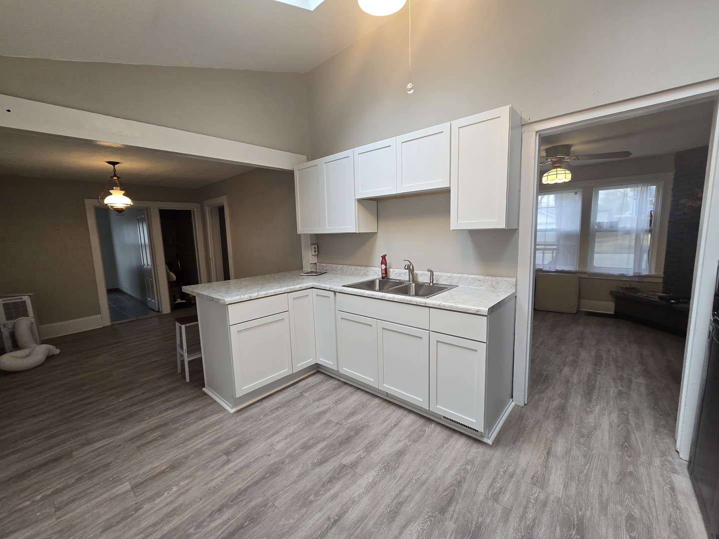 103 West Cherokee Avenue Shabbona, IL 60550 - Photo 31 of 42 a kitchen with a sink cabinets and wooden floor