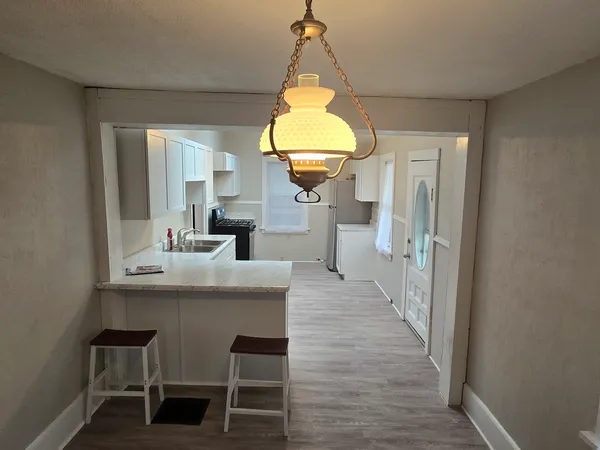 a living room with furniture flat screen tv and a fireplace