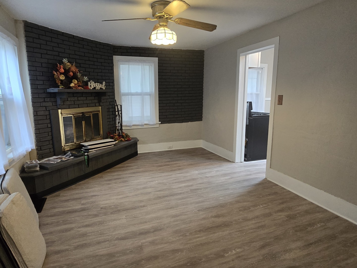 103 West Cherokee Avenue Shabbona, IL 60550 - Photo 37 of 42 a living room with furniture flat screen tv and a fireplace