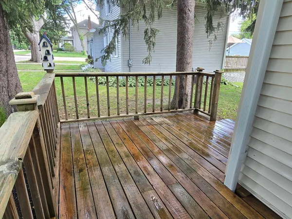 a view of balcony with wooden floor