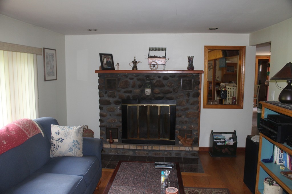 49 Quarry Road Granby, CT 06035 - Photo 14 of 25 a living room with furniture and a fireplace