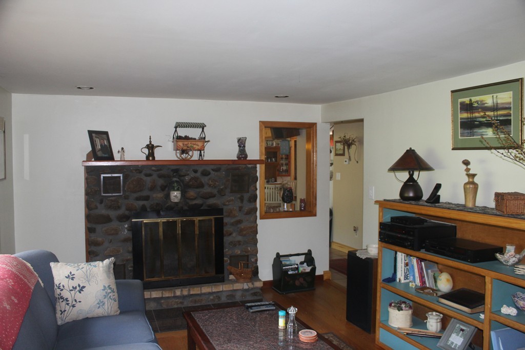 49 Quarry Road Granby, CT 06035 - Photo 15 of 25 a living room with furniture and a fireplace