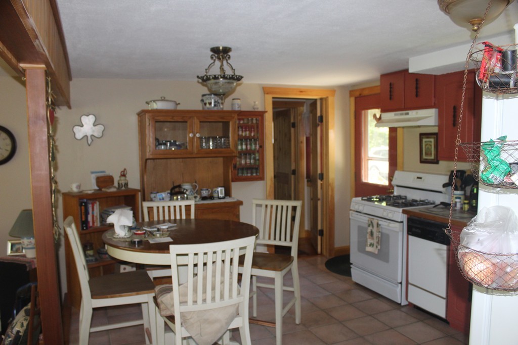 49 Quarry Road Granby, CT 06035 - Photo 18 of 25 a view of a dining room with furniture window and outside view
